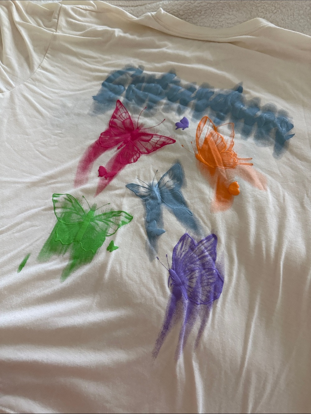 White Graphic Tee with Colorful Butterfly Accents